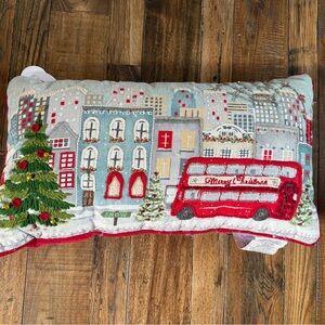 Festive Cityscape Holiday Pillow with Red Bus